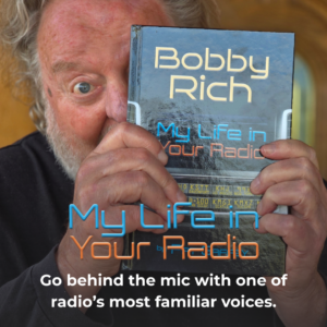Picture of a man holding a book. Text on image says My Life in Your Radio Go behind the mic with one of radio's most familiar voices