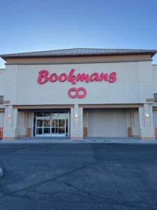 Picture of the bookmans location on rivers store sign which in the print of red