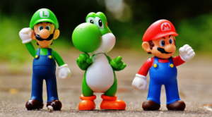 Banner image for Super Smash Bros Event Listing . Picture is of Luigi, Yoshi, and Mario with their fists in the air. IMAGE FROM UNSPLASH.COM