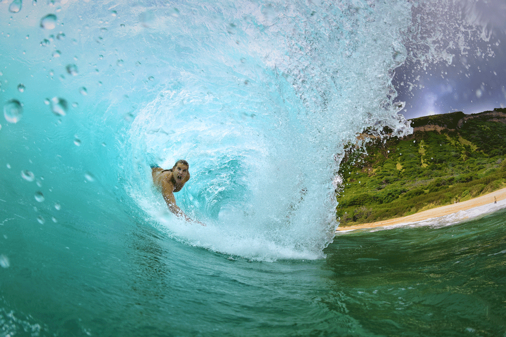 person surfing in the middle of an ocean wave