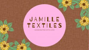 jamille textiles logo on pink circle atop a brown textured background with floral elements on the side